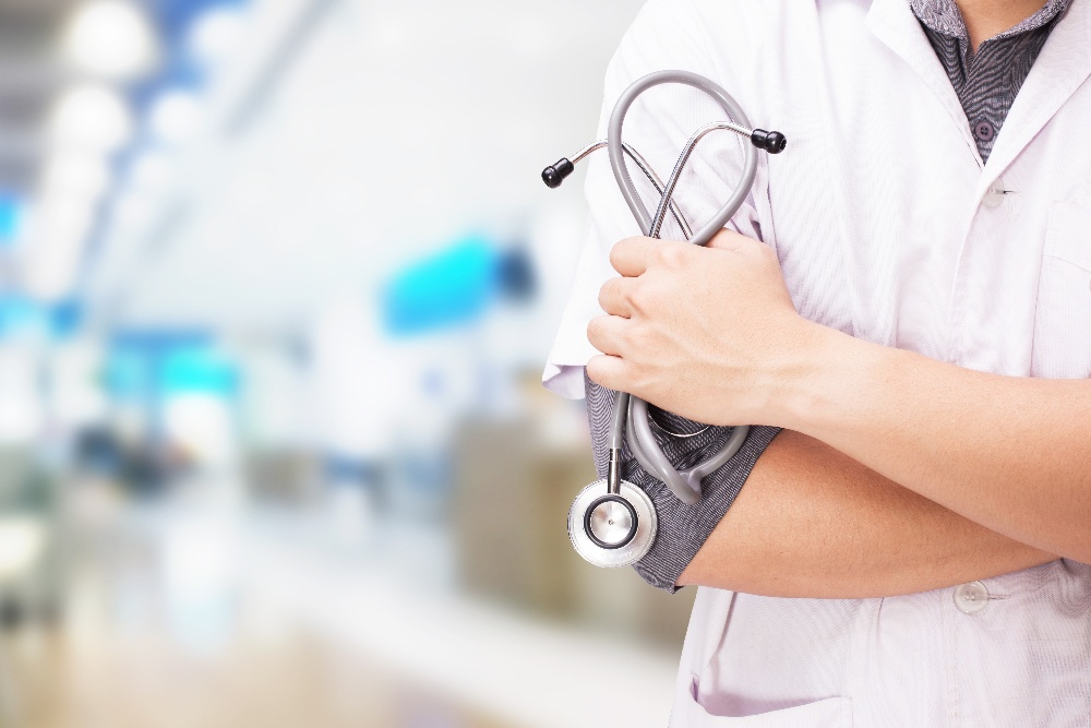 doctor-with-stethoscope-hands-hospital-background-1